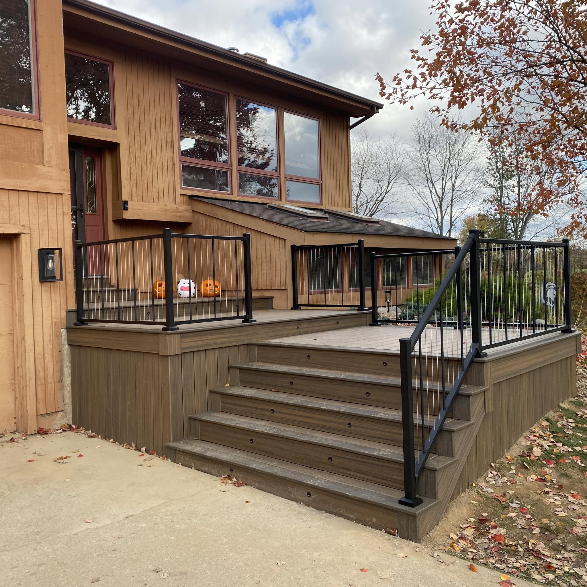 Completed composite entry deck with black metal railing